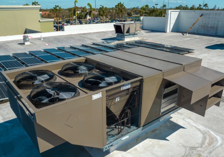 Satisfied business client with a well-maintained HVAC system by NALK Cooling & Heating.