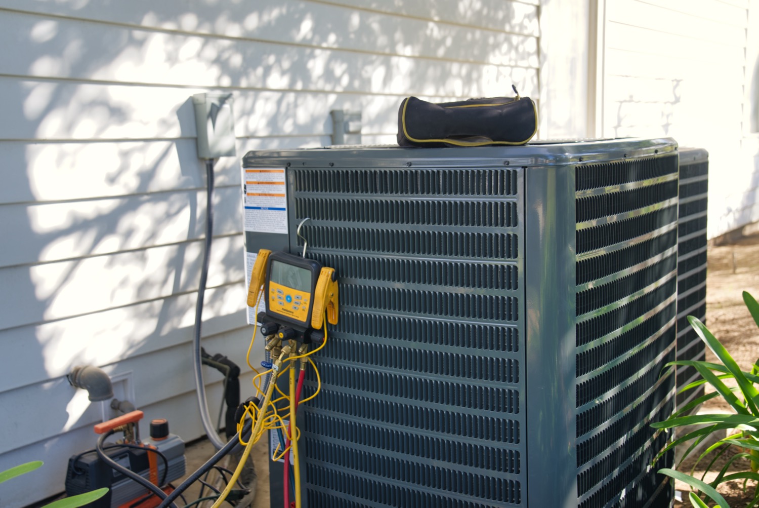 Hvac Tech working on a condensing unit