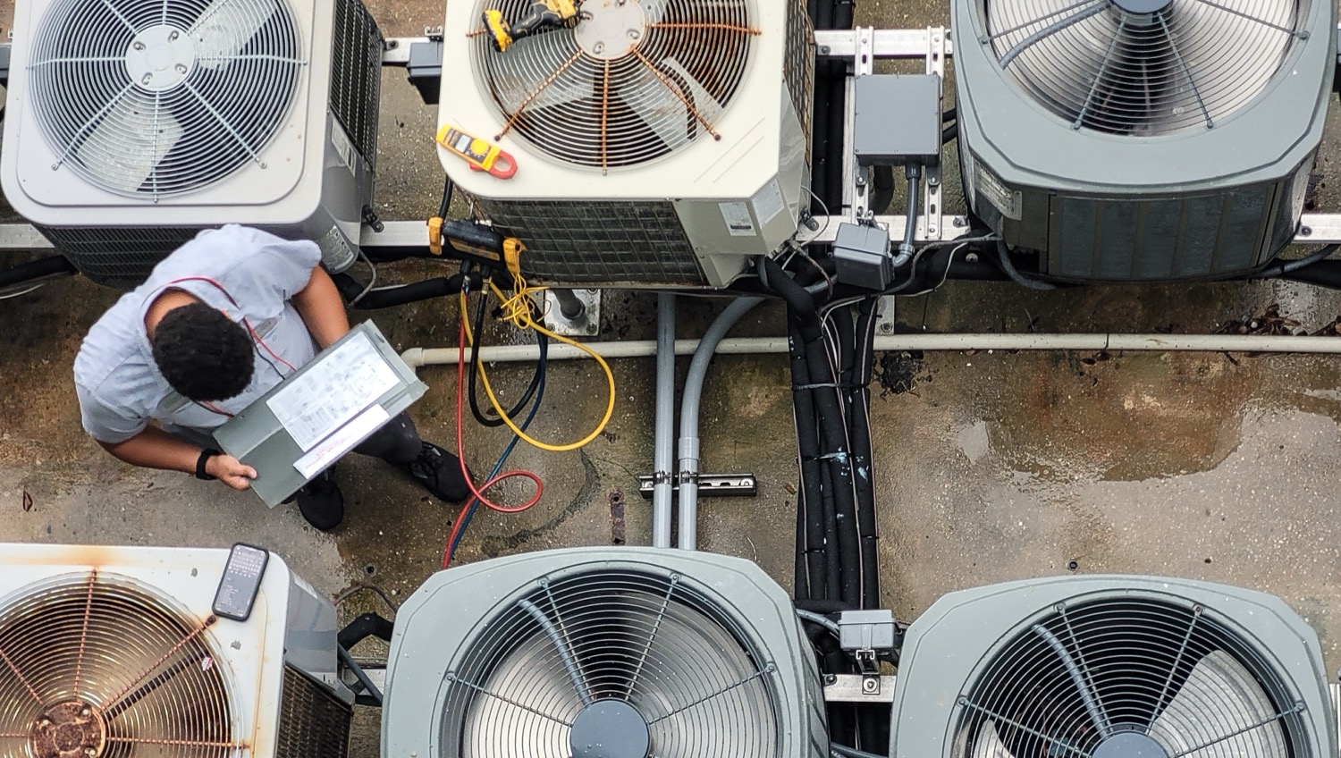 Homeowner scheduling air conditioner repair in Fresno, CA